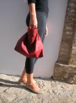 modelling the clutch bag in red